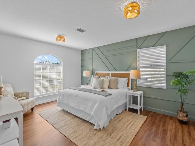 bedroom with hardwood / wood-style flooring