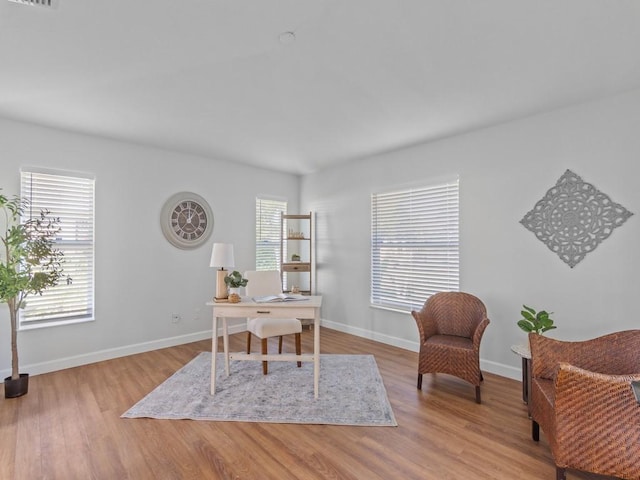 office with light hardwood / wood-style floors