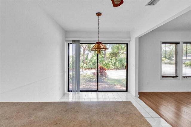 737 Timber Ridge Trl SW Unit B, Vero Beach, FL 32962 - unfurnished dining area featuring light tile patterned floors