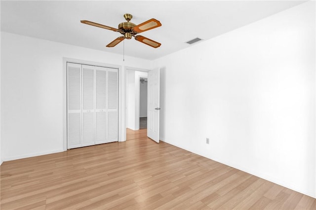 737 Timber Ridge Trl SW Unit B, Vero Beach, FL 32962 - unfurnished bedroom featuring light wood-style flooring, a closet, and a ceiling fan