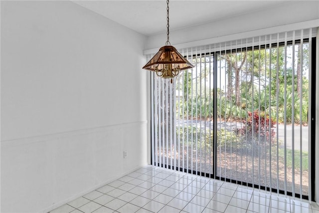 737 Timber Ridge Trl SW Unit B, Vero Beach, FL 32962 - unfurnished dining area featuring a chandelier and light tile patterned floors
