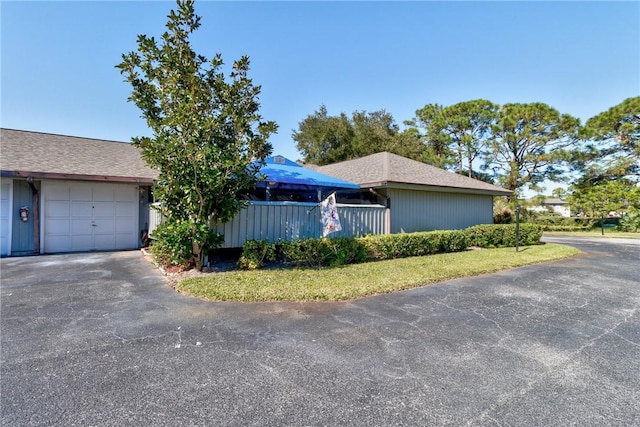 737 Timber Ridge Trl SW Unit B, Vero Beach, FL 32962 - view of front of home with asphalt driveway and an attached garage