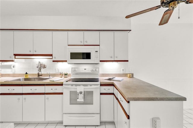 737 Timber Ridge Trl SW Unit B, Vero Beach, FL 32962 - kitchen featuring white appliances, a peninsula, light tile patterned flooring, white cabinetry, and a ceiling fan