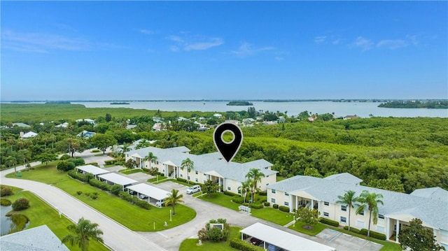 aerial view with a water view and a residential view