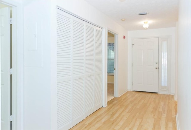 entrance foyer featuring baseboards and light wood-style floors