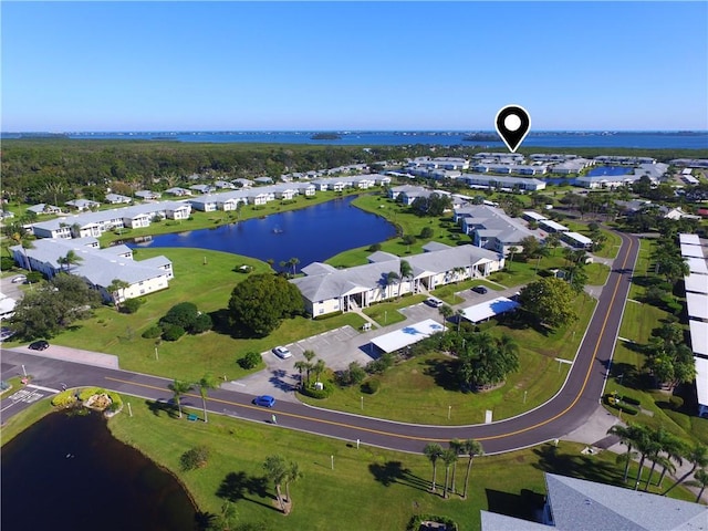 bird's eye view with a residential view and a water view