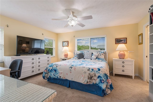 bedroom with a ceiling fan and carpet floors