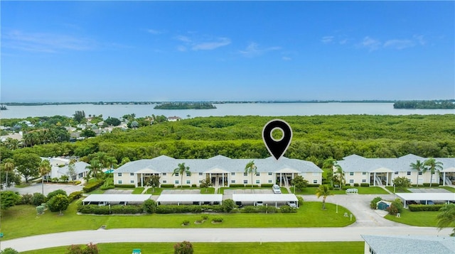 birds eye view of property featuring a residential view and a water view