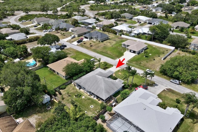 birds eye view of property with a residential view