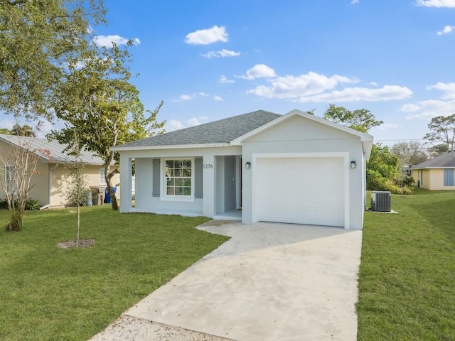 single story home featuring central AC, a garage, and a front yard