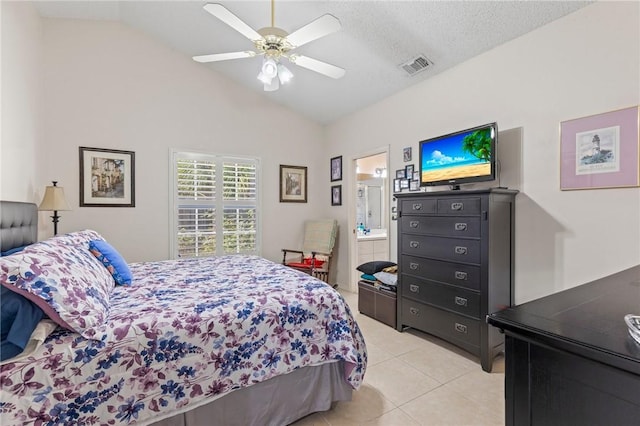 881 Foster Ave, Sebastian, FL 32958 - bedroom with lofted ceiling, light tile patterned flooring, ceiling fan, and connected bathroom