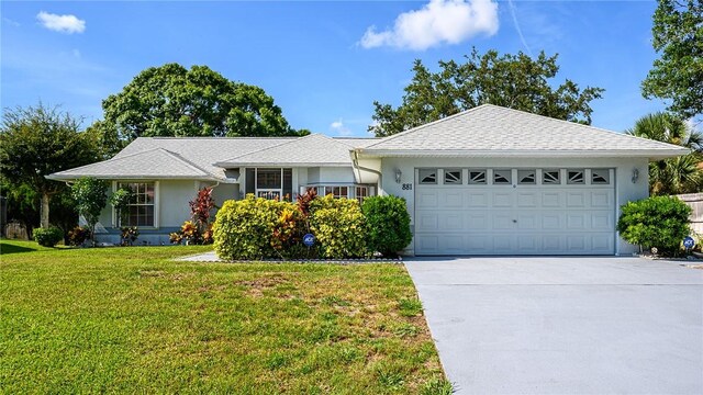 881 Foster Ave, Sebastian, FL 32958 - single story home with stucco siding, a garage, concrete driveway, and a front lawn