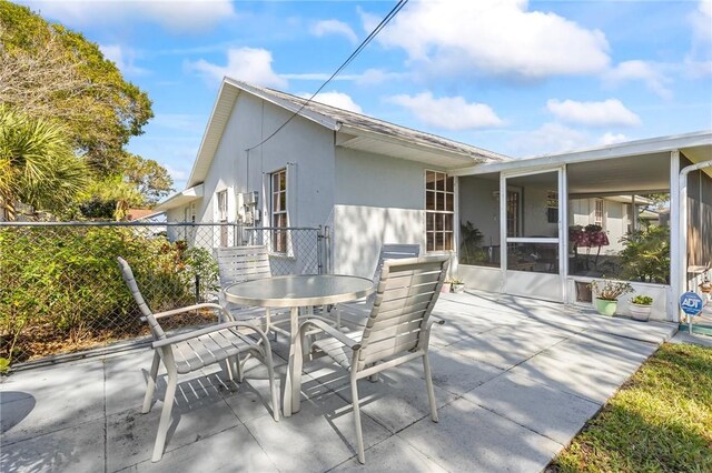 881 Foster Ave, Sebastian, FL 32958 - view of patio with outdoor dining space and a sunroom