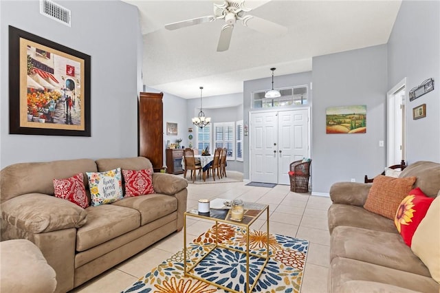 881 Foster Ave, Sebastian, FL 32958 - living room featuring a chandelier, light tile patterned floors, and ceiling fan