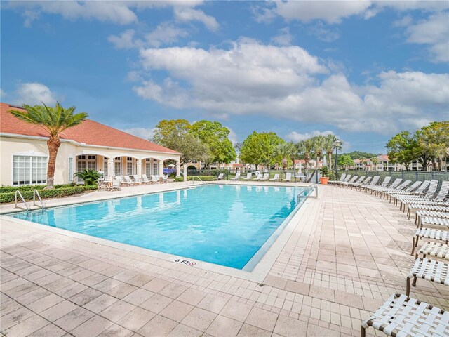 view of pool featuring a patio