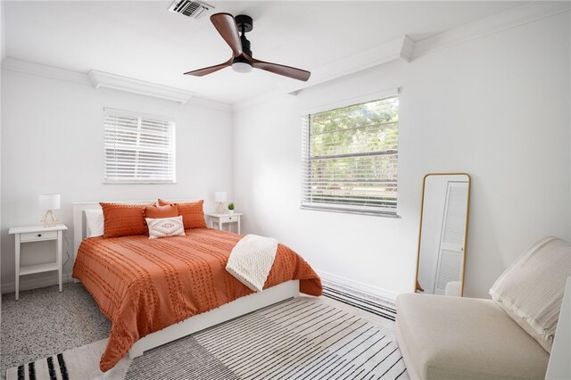 bedroom featuring ceiling fan and ornamental molding