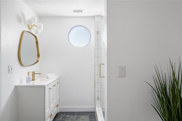 bathroom with a shower and vanity