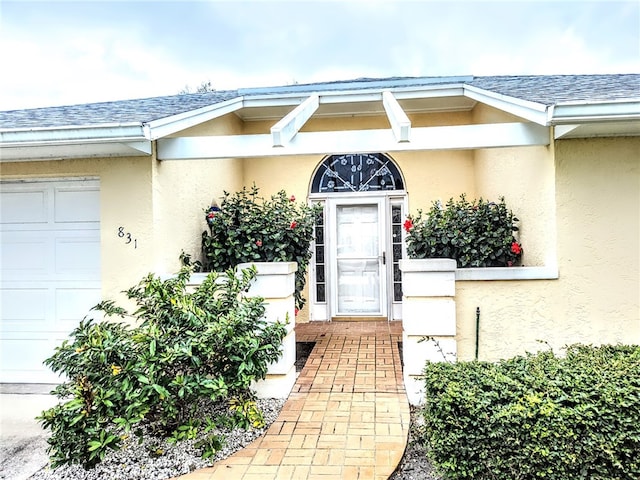 doorway to property featuring a garage