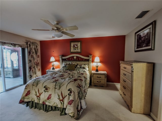 bedroom with light carpet, access to exterior, and ceiling fan