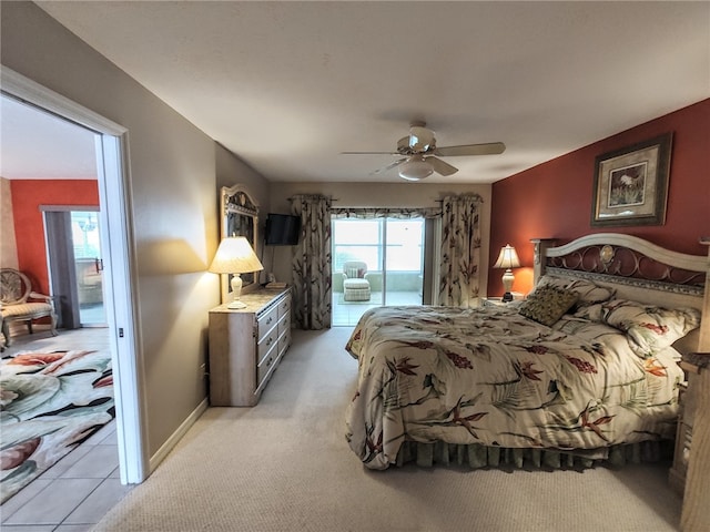 carpeted bedroom featuring ceiling fan and access to exterior