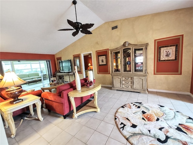 living room with ceiling fan, light tile patterned flooring, and lofted ceiling