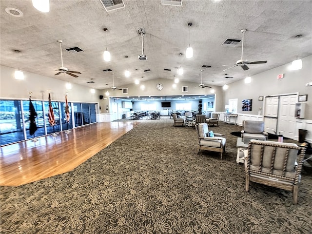 misc room with ceiling fan, hardwood / wood-style floors, and high vaulted ceiling