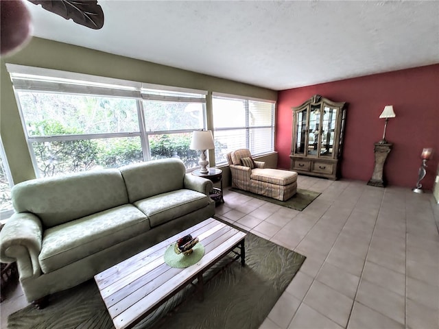 living room with plenty of natural light and light tile patterned flooring