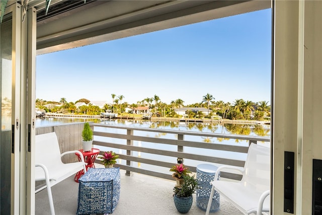 balcony featuring a water view