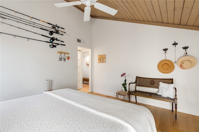 bedroom with ceiling fan, hardwood / wood-style floors, wooden ceiling, and lofted ceiling