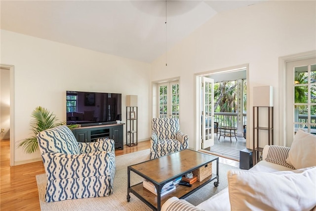 1155 Winding Oaks Cir E Unit 104, Vero Beach, FL 32963 - living area featuring light wood-type flooring and high vaulted ceiling