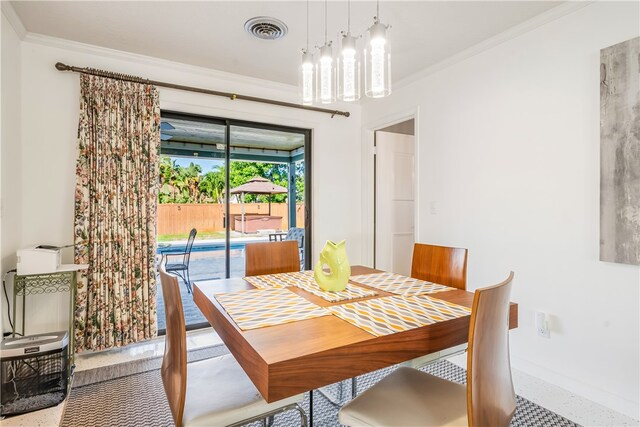 dining space featuring ornamental molding