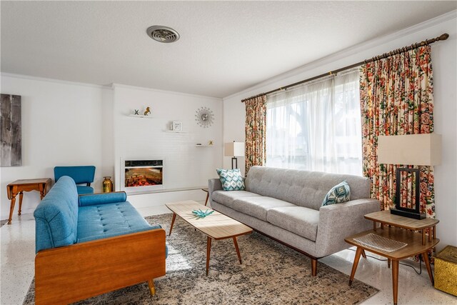 living room with a textured ceiling and crown molding