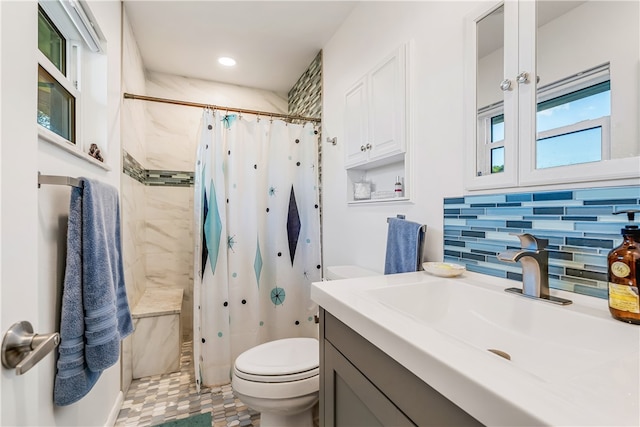 bathroom with toilet, tasteful backsplash, vanity, and curtained shower