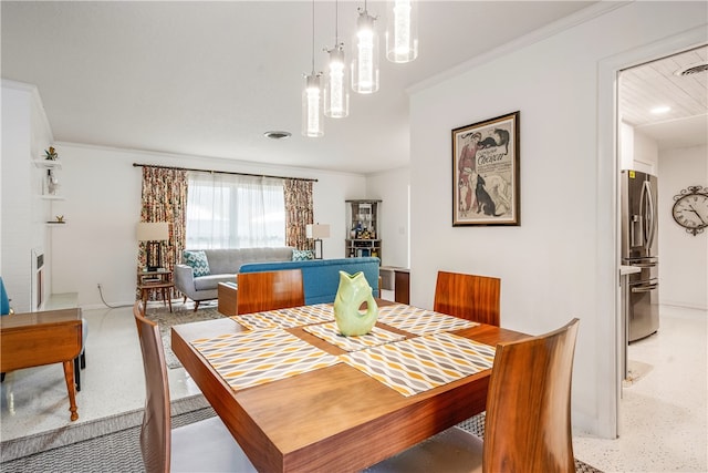 dining space featuring ornamental molding