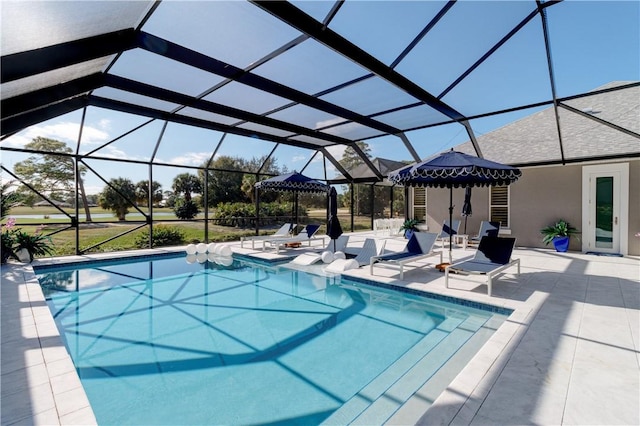 view of pool featuring a lanai and a patio