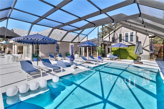 view of pool featuring a patio area and a lanai