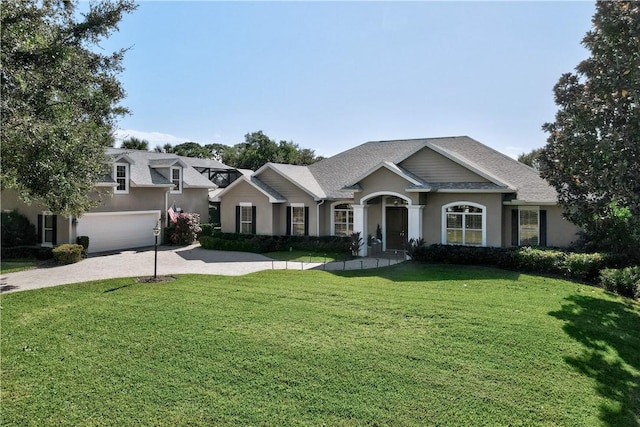 view of front of home featuring a garage and a front yard