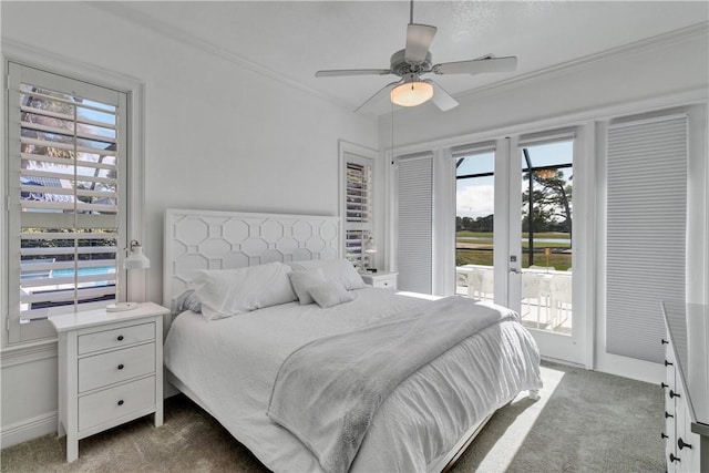 bedroom featuring access to exterior, dark colored carpet, ceiling fan, and crown molding