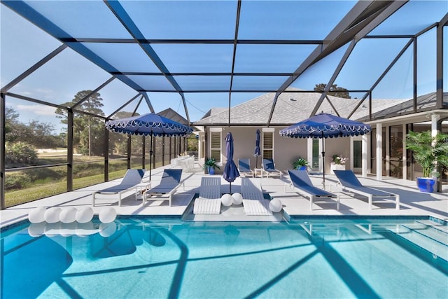 view of swimming pool featuring a lanai and a patio area