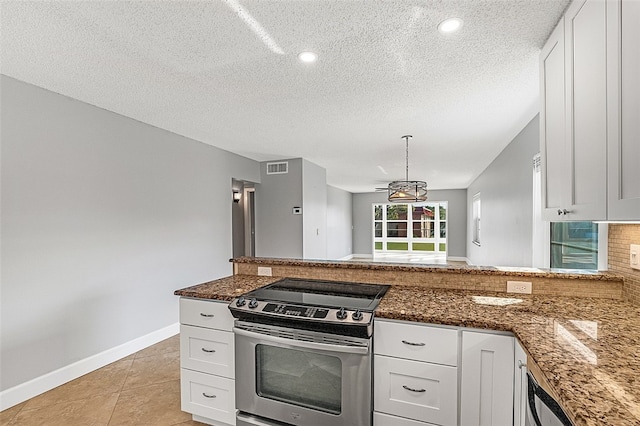 kitchen featuring white cabinets, stainless steel electric range oven, dark stone counters, and pendant lighting