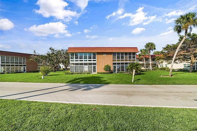 exterior space with a front lawn