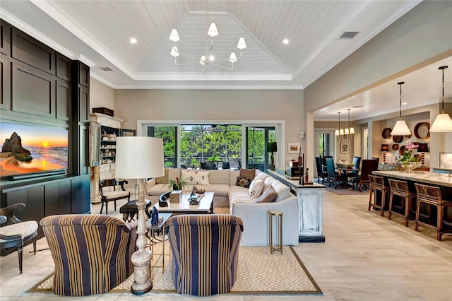 living room with an inviting chandelier, high vaulted ceiling, ornamental molding, a raised ceiling, and light wood-type flooring