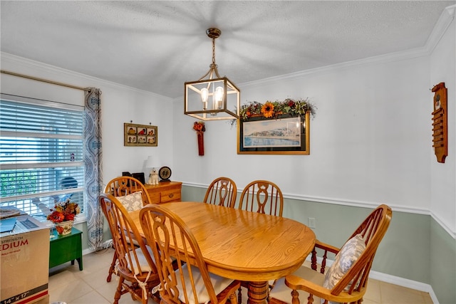 dining room featuring an inviting chandelier, crown molding, light tile patterned floors, and a textured ceiling