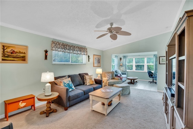 living area featuring baseboards, ceiling fan, vaulted ceiling, light carpet, and a textured ceiling