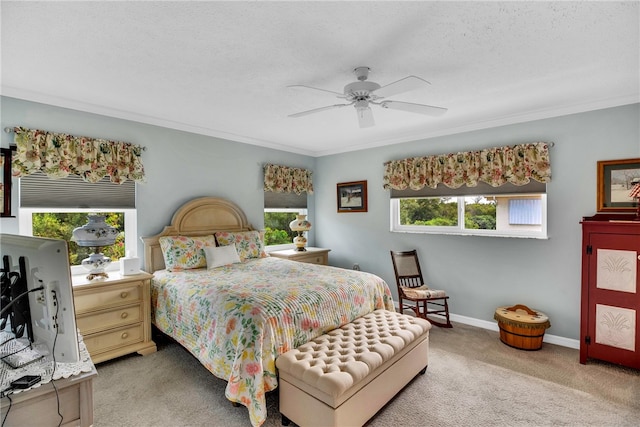 bedroom featuring ceiling fan, carpet floors, and multiple windows