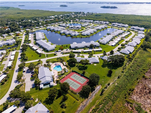 drone / aerial view featuring a residential view and a water view