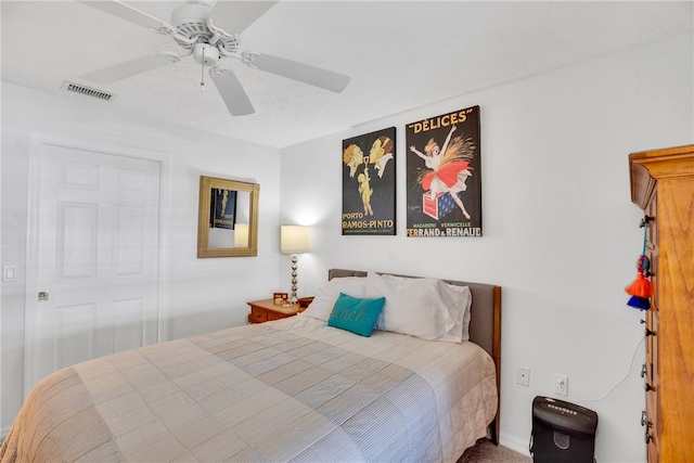 bedroom featuring visible vents and ceiling fan