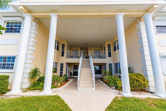 doorway to property with stucco siding