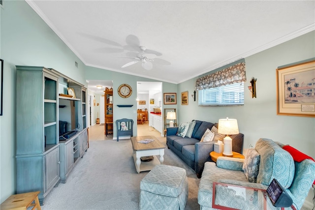 carpeted living room featuring ceiling fan, ornamental molding, and vaulted ceiling