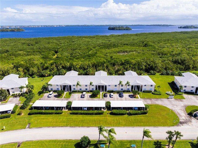740 Lake Orchid Cir Unit 205, Vero Beach, FL 32962 - bird's eye view of a large body of water and a heavily wooded area